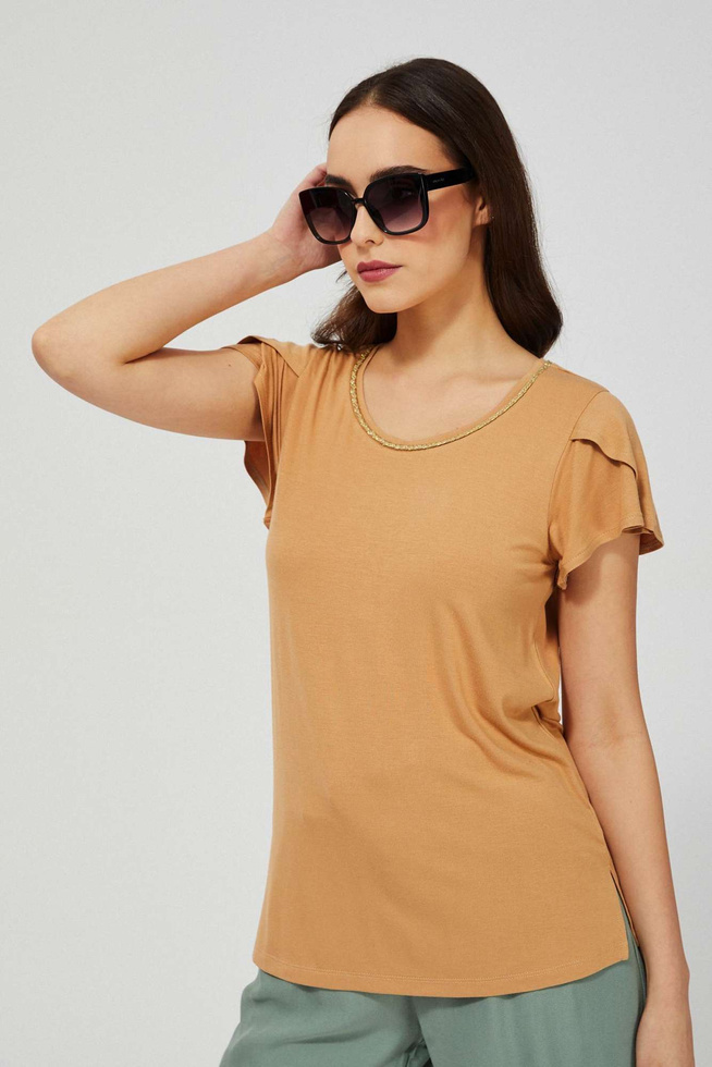 Blouse with a decoration at the neckline