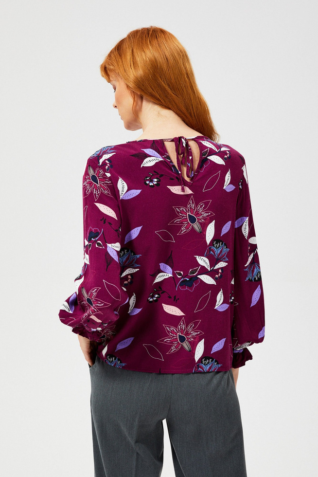 Floral shirt with a tie on the back