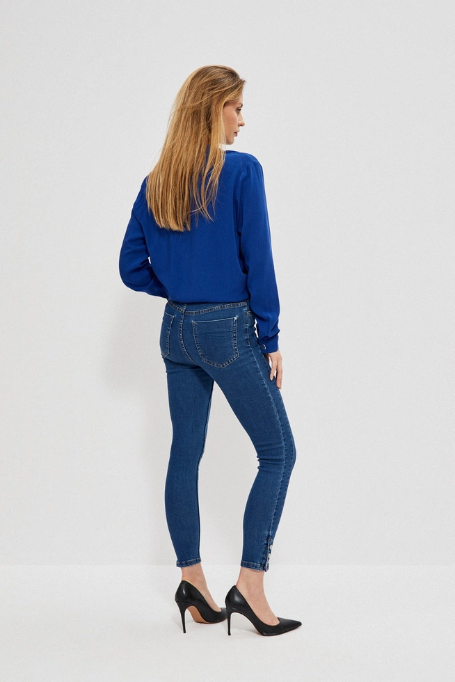 Skinny jeans with decorative buttons