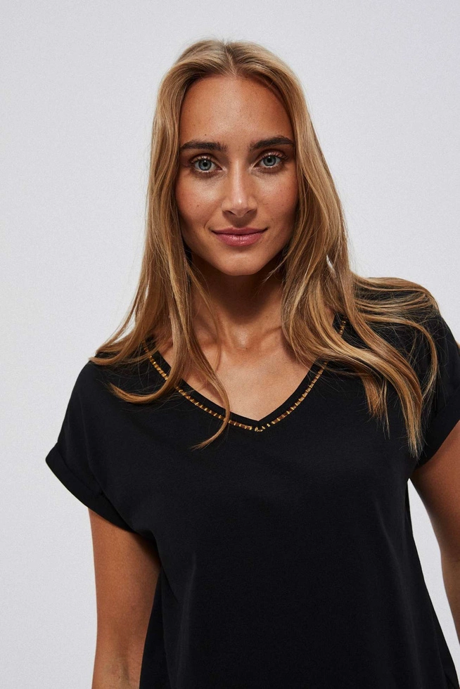 Plain blouse with a decorative neckline