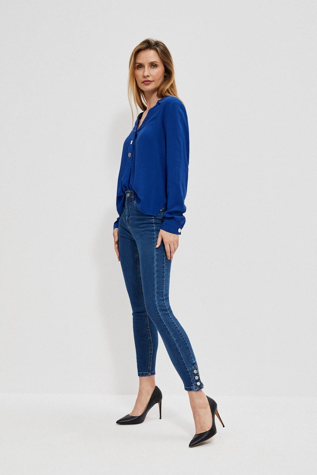 Skinny jeans with decorative buttons