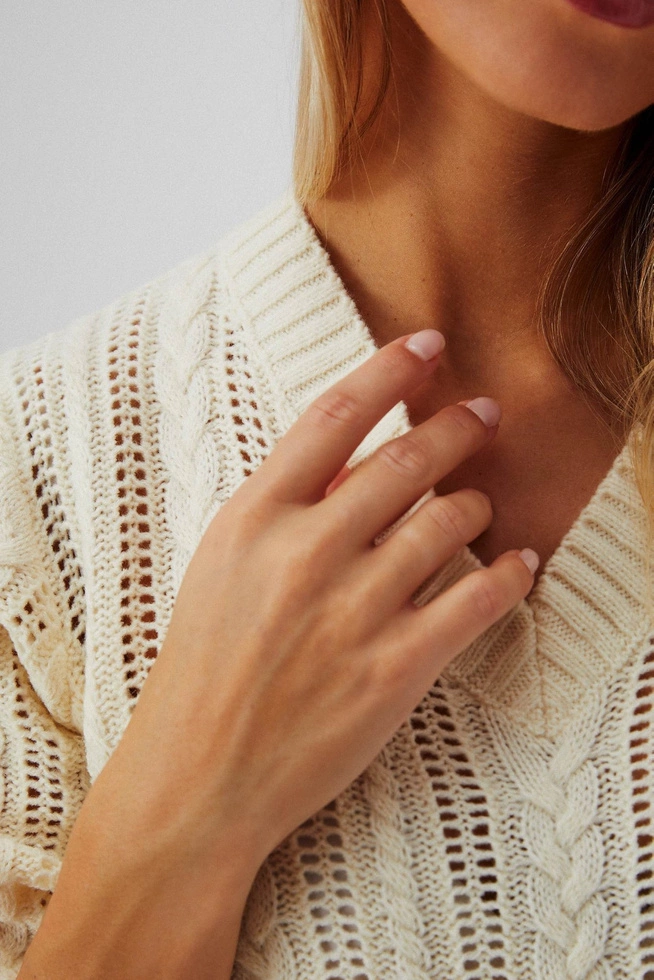 Sweater with a braid pattern