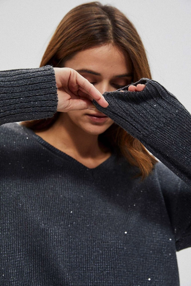 Sweater with a neckline on the back