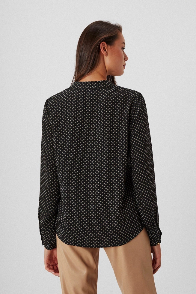 Patterned shirt with a decorative neckline