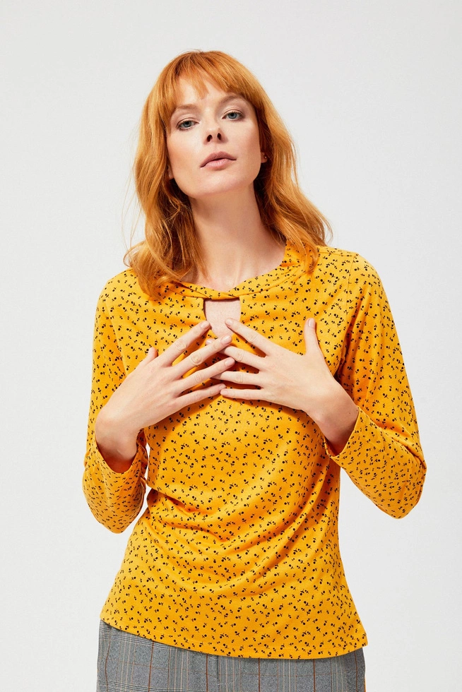 A floral blouse with a cut-out at the neckline