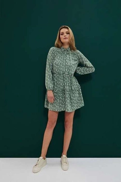 Patterned dress with a frill