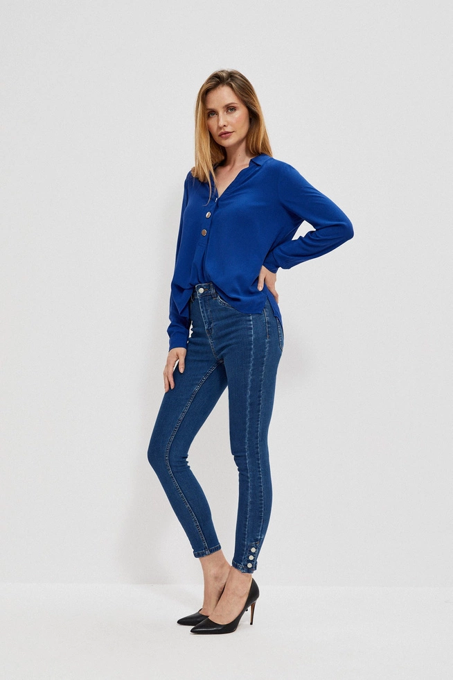 Skinny jeans with decorative buttons